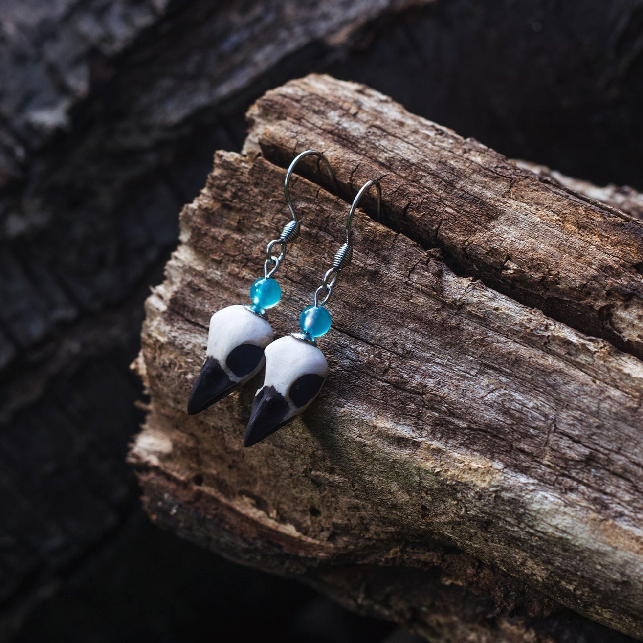 Bird Skull Earrings with light blue beads ā handmade mystical jewelry Riga