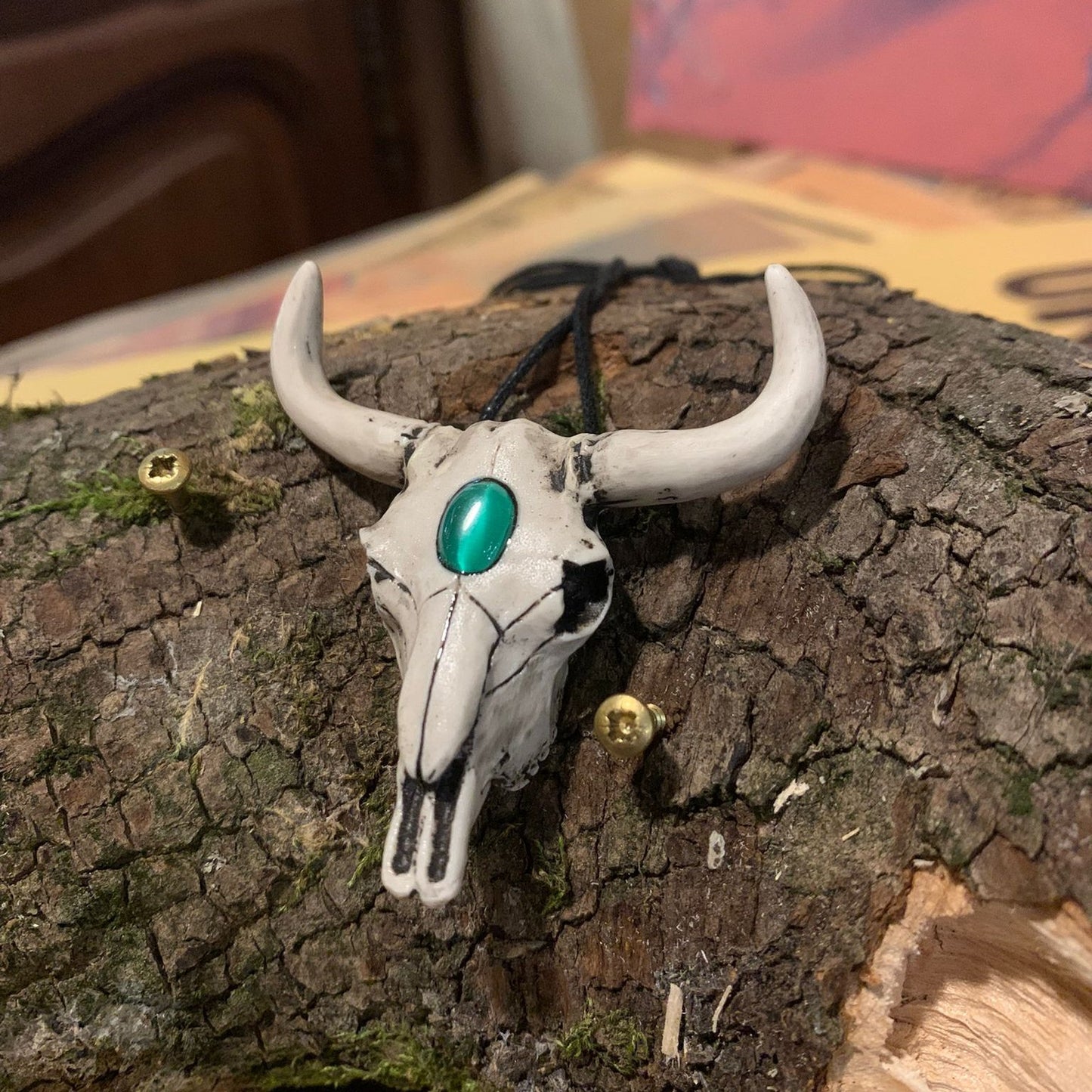 Bull skull pendant with green bead decoration
