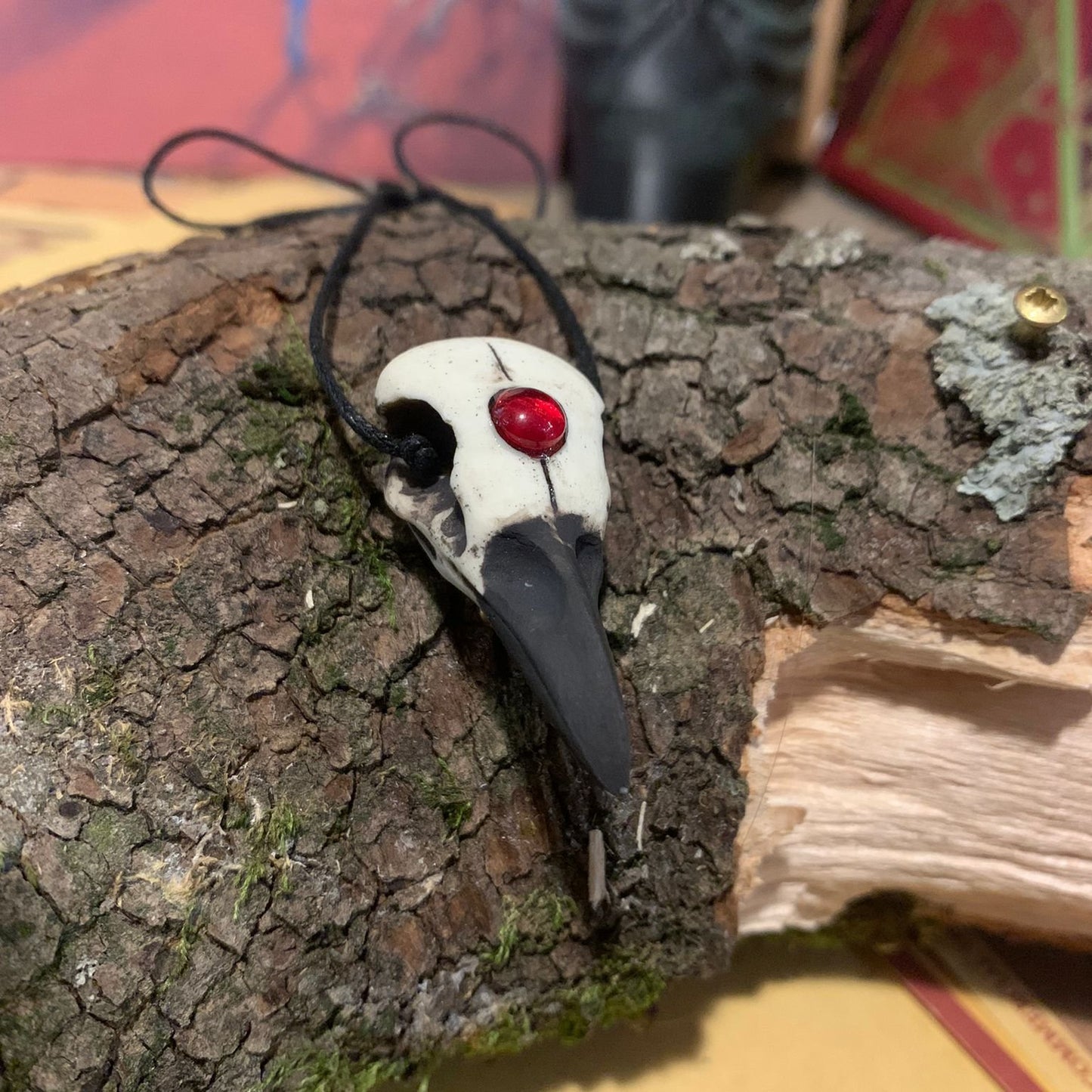 Raven skull pendant red bead