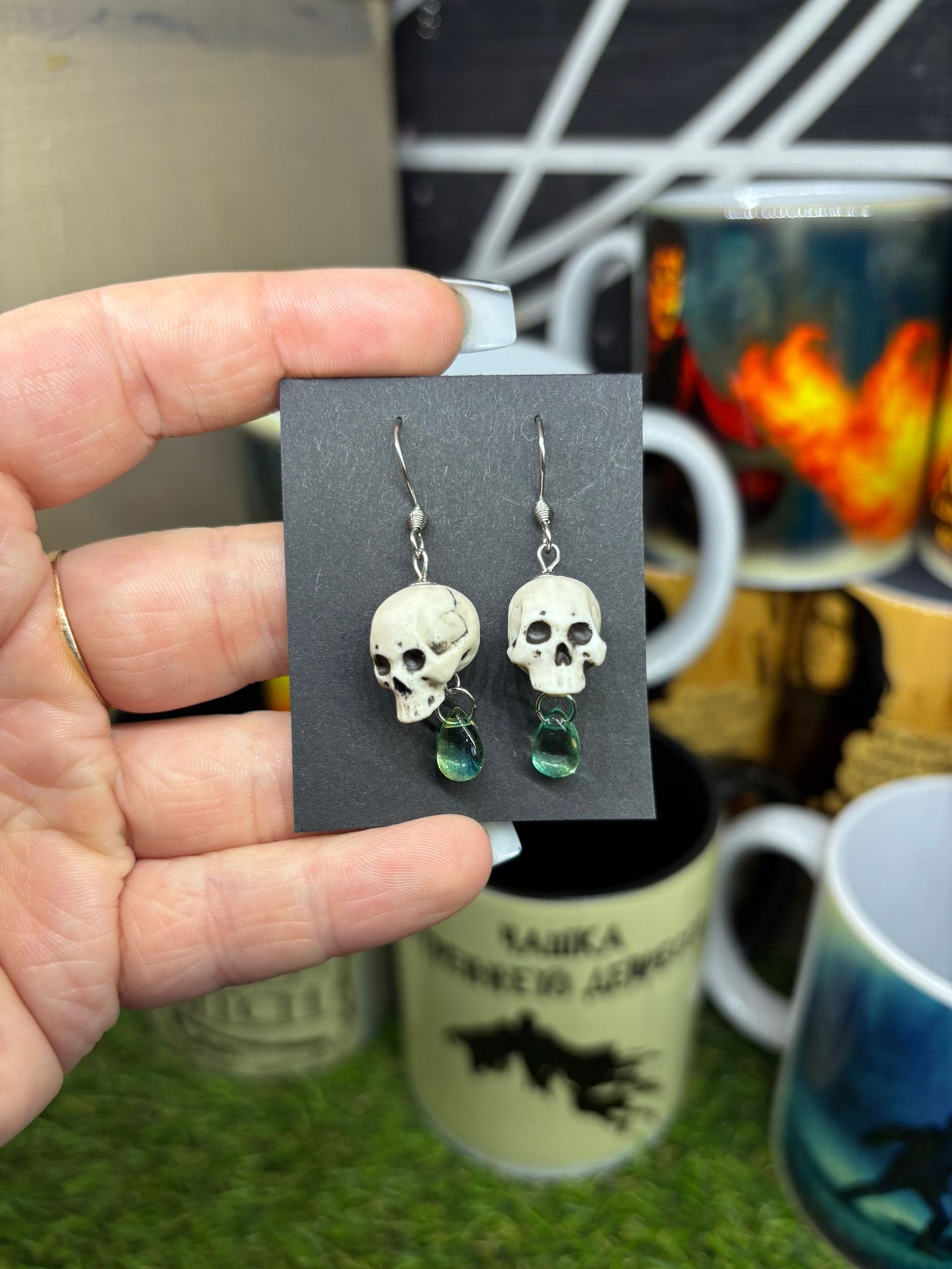 Human skull earrings with light green beads – fantasy style jewelry