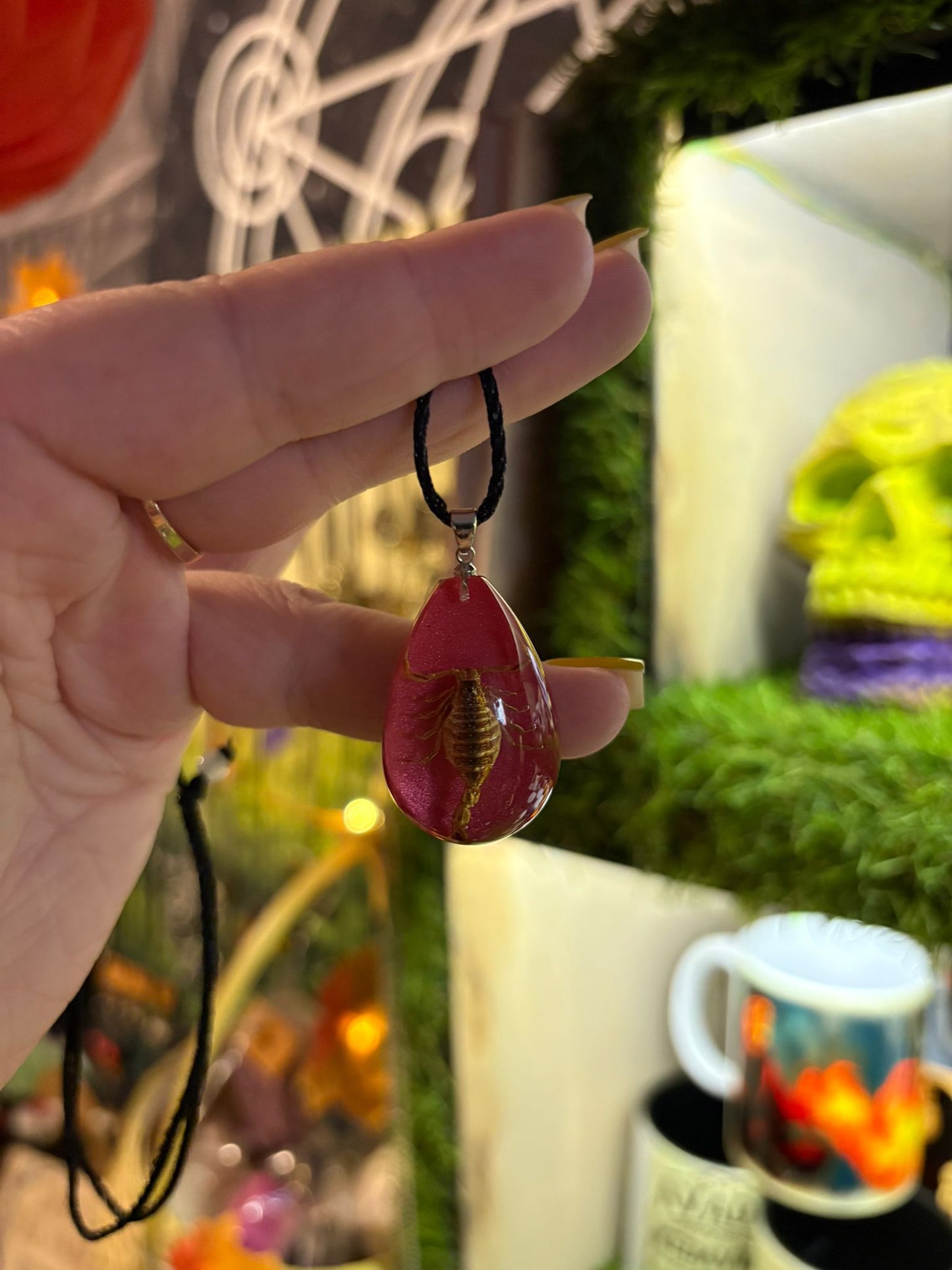 Pink sparkling resin necklace with scorpion.