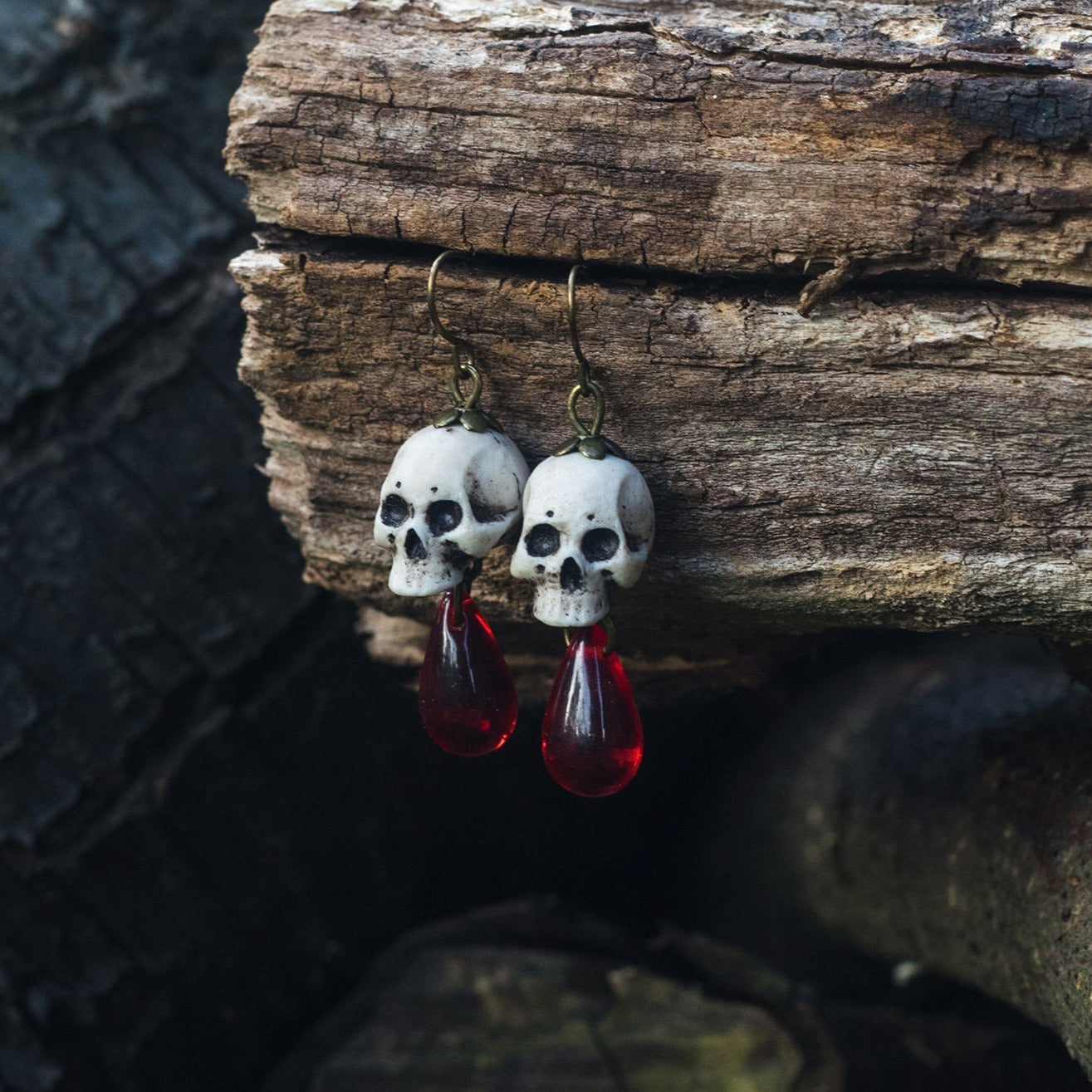 Human skull earrings with red beads – witchcraft style jewelry